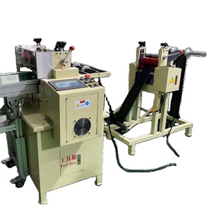 Machine de découpe automatique de rouleaux de ruban adhésif sur convoyeur - Product Image 1