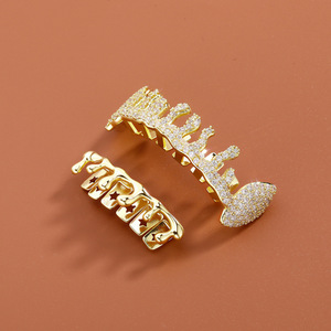 กริลล์ซสำหรับฟัน ชุดสีทอง ลายดาวแบบไม่สมมาตร ดีไซน์เรขาคณิต ประดับด้วยไมโครอินเซิร์ต เหมาะสำหรับงานปาร์ตี้ ใช้ได้ทั้งชายและหญิง กริลล์ซคุณภาพดี - Product Image 4