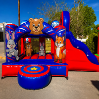 Château gonflable commercial avec toboggan et aire de saut pour enfants, idéal pour les fêtes en extérieur et la location événementielle