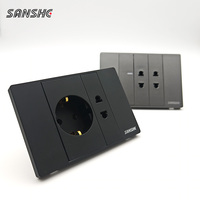 SANSHE Interruptor de Pared Moderno Empotrado de 3 Ganglios y 1 Vía con Enchufe Schuko, Marco de PC con Abrazaderas y Garras para Cables, Negro, Paquete de 2 Tomas de Corriente Alterna