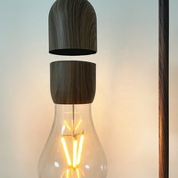 Chargeur électrique inductif sans fil Ampoule à lévitation pratique Lampe de chevet à lévitation magnétique Cadeaux personnalisés