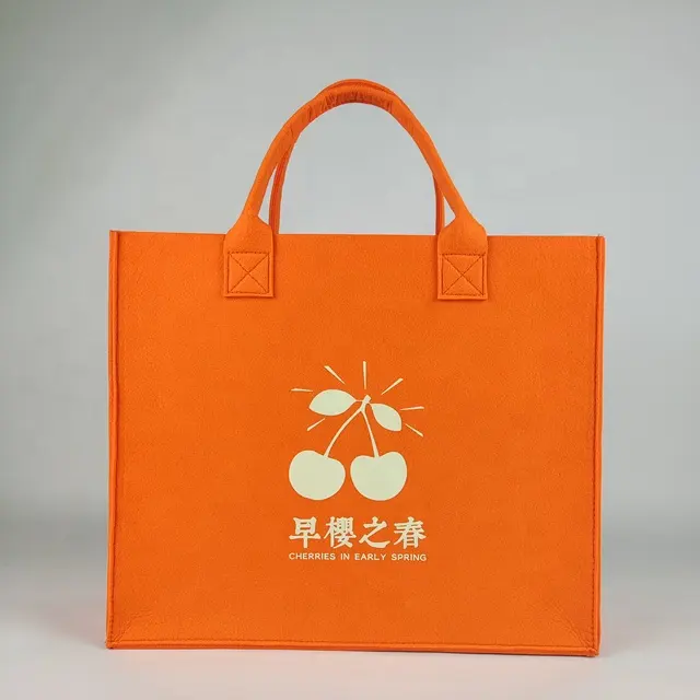 بيع بالجملة الأكثر مبيعًا حقائب تسوق فاخرة قابلة لإعادة الاستخدام حقيبة حمل كبيرة من اللباد البرتقالي مع شعار مطبوع مخصص