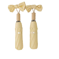 Parapluie de poche mini pliable manuel avec nœud papillon, logo personnalisé OEM, revêtement noir UPF50, 8 baleines, pour femmes et filles