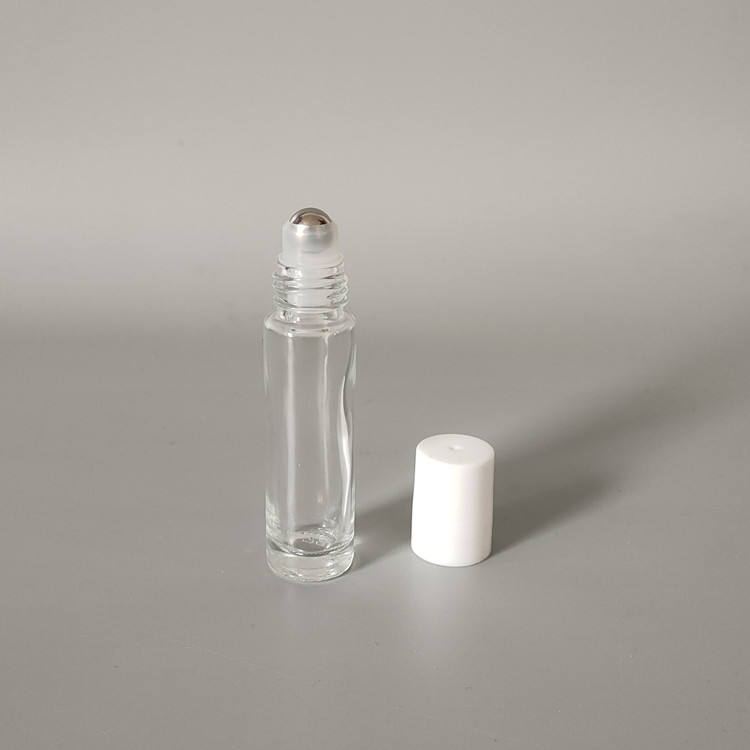 Clear bottle + steel ball + white plastic cap