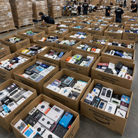 Boîte mystère d'électronique en surplus pré-testée : téléphones portables, tablettes, casques, batteries externes pour les vendeurs de plateformes, approvisionnement en gros