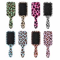 Brosse à cheveux en gros à imprimé léopard, brosse démêlante à coussin d'air pour massage du cuir chevelu pour femmes, logo personnalisé OEM ODM pour salon de coiffure