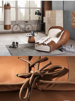Fauteuil de salon individuel créatif en cuir PU, design inspiré d'un gant de boxe italien, style luxe léger