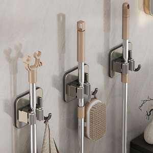 Soporte de pared moderno para escobas y fregonas, de acero inoxidable color gris bronce, con doble gancho, para baño, instalación sin taladro. - Product Image 1
