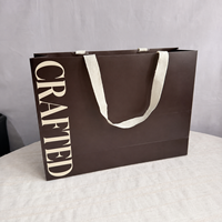 Sacs shopping en papier de luxe marron chocolat personnalisés avec logo et poignées en ruban de coton pour l'emballage de vêtements et de cadeaux