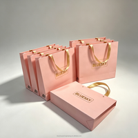 Sac fourre-tout en papier de luxe personnalisé OEM/ODM avec poignée intégrée, sacs en papier durables pour emballages de bijoux et de vêtements