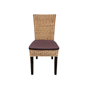 The wicker <b>dining</b> <b>chair</b> features plush cushions, offering charming comfort and rustic elegance, perfect for home and beyond. - Product Image 1