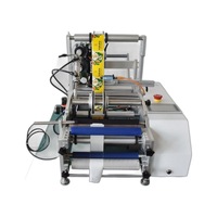 Machine d'étiquetage semi-automatique pour bouteilles rondes à double face avec positionnement pour petites bouteilles