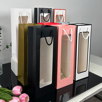 Fabricant de sacs cadeaux en PVC en stock sacs en papier de vin rouge à fenêtre transparente à longue bande pour emballage de bouquet de parfum à bougie