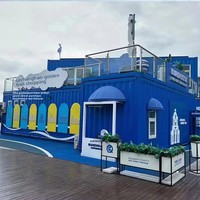 Boutique de vente au détail modulaire en conteneur maritime à deux étages, avec structure en acier, couleurs personnalisables, fenêtres en verre et écran LED