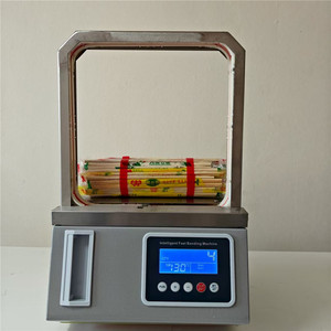Máquina flejadora inteligente de fusión en caliente totalmente automática para el embalaje de verduras y artículos pequeños de papel - Product Image 1