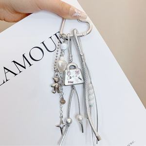 Breloque de sac à main en métal argenté pour téléphone portable, avec sangle en cuir PU et pompon, pour femmes - Product Image 1