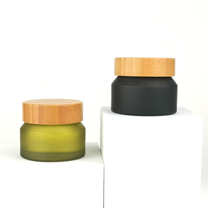 Barattolo in <span class=keywords><strong>Vetro</strong></span> Opaco Nero con Spalla Inclinata 50g per Crema Viso Cosmetica, Barattolo in <span class=keywords><strong>Vetro</strong></span> Verde Oliva Satinato <span class=keywords><strong>50</strong></span> <span class=keywords><strong>ml</strong></span> con Coperchio in Bambù - Product Image 1