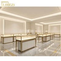 Comptoir de présentation de bijoux en verre trempé blanc or haut de gamme avec rangement intégré