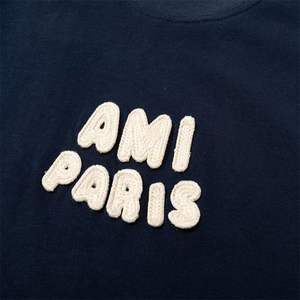 Camiseta de manga corta AMI para parejas, estilo moderno, con logotipo bordado en 3D, holgada y fácil de combinar. - Product Image 5