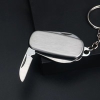 Vente directe du fabricant, porte-clés multifonctionnel avec couteau à 4 points et porte-clés