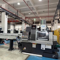 Tour CNC de type suisse à double broche ST-203 avec système Fanuc, machine combinée de tournage et de fraisage avec chargeur automatique de barres pour le métal