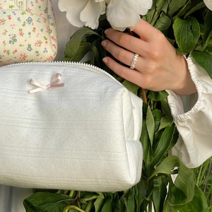 In stock: Heart-shaped bow cosmetic bag, large capacity <b>toiletries</b> <b>storage</b> bag, white moonlight outdoor travel cosmetic bag. - Product Image 1