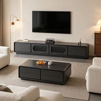 Ensemble meuble TV et table basse gris foncé moderne et durable, console multimédia noir mat avec tiroirs de rangement, détails en grille de rotin écologique
