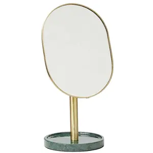 时尚金色椭圆形剪影梳妆台镜子，带绿色大理石底座