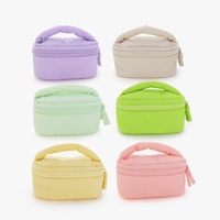 Nouvelle mode de trousse de maquillage de luxe de marque pour femmes trousse de toilette de voyage trousse à cosmétiques personnalisée rembourrée et moelleuse