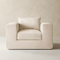 Fauteuil d'appoint de salon de style moderne français, sculptural, fait main, avec dossier arrondi et coussins en plumes, confort moelleux
