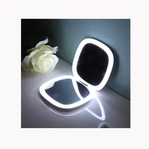 2024 Logo personnalisé maquillage miroir cosmétique Portable miroir de maquillage lumière LED avec miroir de forme ronde en plastique