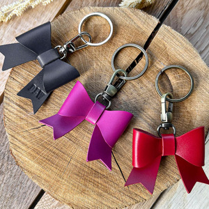 In stock, simple PU leather keychains, <b>bag</b> charms, sweet bow-shaped pendants, creative <b>key</b> <b>rings</b>. - Product Image 2
