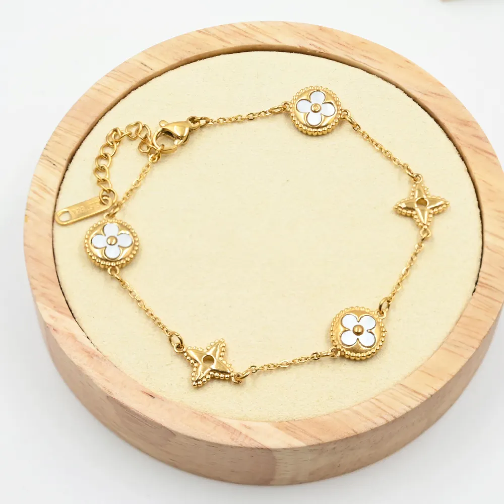 Braccialetto di gioielli squisiti di moda di nuovo Design in oro 18 carati di alta qualità bracciale in acciaio inossidabile con catena a quattro foglie di trifoglio da donna