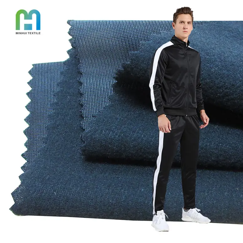 Tissu brossé en tricot de polyester teint uni de couleur noire durable en utilisation tissu de vêtements de sport de course pour survêtement vierge