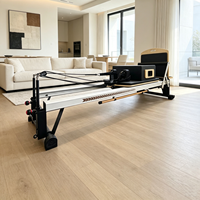 Machine de Pilates Reformer professionnelle blanche et noire avec ressorts calibrés pour le tonification