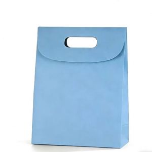 Sacs en papier kraft bleu personnalisés avec poignées découpées, recyclables et adaptés aux pâtisseries, aux collations et aux articles similaires. - Product Image 1