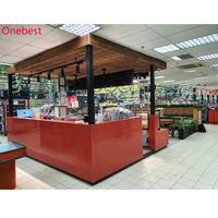 Comptoir de bar rétroéclairé avec logo en forme de U en pierre de quartz Corian rouge de Chine pour kiosque de fruits