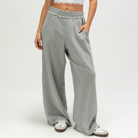 Pantalon de survêtement décontracté gris chiné taille basse à jambes larges pour femme, design moderne, avec volants à la taille et poches latérales, vente en gros