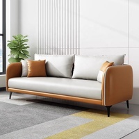 Ensemble de canapés en cuir PU bicolore gris caramel avec accoudoirs incurvés et pieds métalliques coniques, idéal pour le bureau et la réception