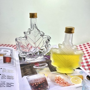 Bouteilles en verre uniques en forme <span class=keywords><strong>de</strong></span> feuille d'érable 50ml 100ml 250ml pour le stockage <span class=keywords><strong>de</strong></span> <span class=keywords><strong>rhum</strong></span> noir et <span class=keywords><strong>de</strong></span> boissons haut <span class=keywords><strong>de</strong></span> gamme - Product Image 4