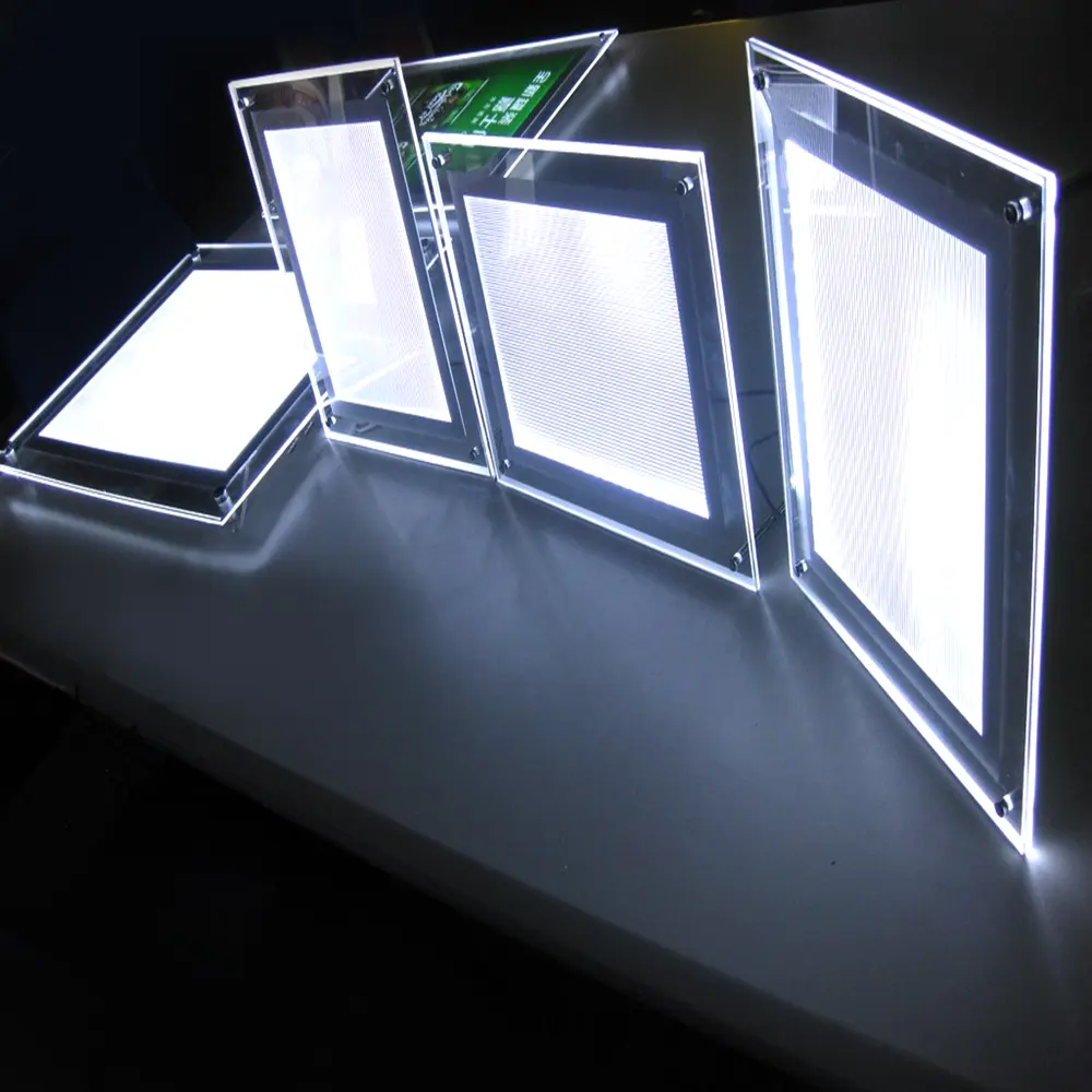 การออกแบบล่าสุดแผงโฆษณา LED ไร้กรอบไฟ LED โปร่งใสแสดงร้านค้าแสดงเคล็ดลับข้อมูลสําหรับโคมไฟตั้งโต๊ะ LED อะคริลิค A4