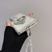 Étui de téléphone de luxe élégant avec strass scintillants et miroir en forme de cœur pour Samsung Galaxy S26 Ultra S25 A55, avec dragonne en cristal