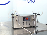 Machine de remplissage de liquides semi-automatique à double tête, machine de remplissage pneumatique, machine de remplissage de bureau portable