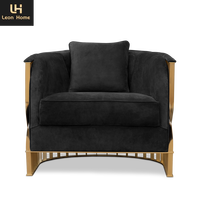 Fauteuils d'appoint modernes en velours noir avec pieds dorés et structure métallique de luxe pour salon familial