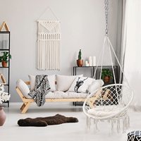 Fauteuil suspendu en macramé Woqi avec poche pour un confort supérieur