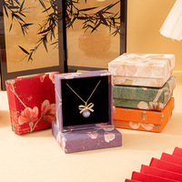Boîtes à bijoux miniatures en gros, nouveau style chinois, gaufrées à motifs floraux, petites boîtes d'emballage pour bagues, bracelets et ornements