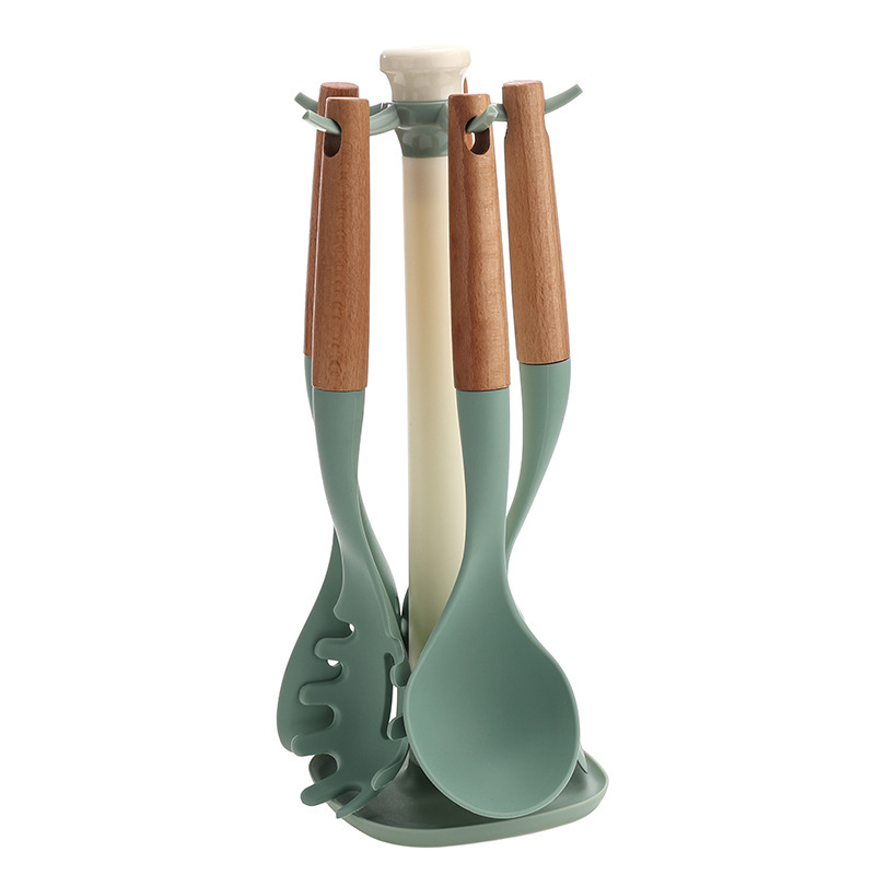 Ensemble d'ustensiles de cuisine 6 pièces avec manche en bois vert et support rotatif.