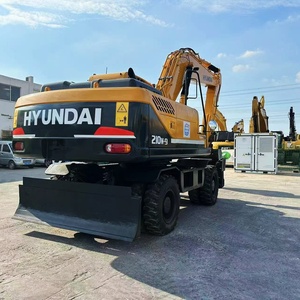 รถขุดล้อยางมือสอง HYUNDAI 210W-9 ขนาด 20 ตัน สำหรับปรับระดับพื้นที่หญ้า  พร้อมเครื่องยนต์แข็งแกร่ง  รุ่น Multi-Terrain Dominator - Product Image 1