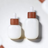 Flacon compte-gouttes ovale en verre Doully pour huiles essentielles et collyres, surface transparente, formats 15 ml et 30 ml, emballage cosmétique