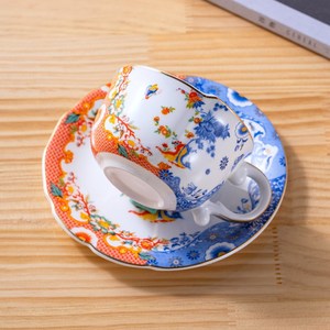 Taza y Platillo de Café de Porcelana China Estilo Nuevo - Asa Pintada en Oro, Loto Azul Blanco - Product Image 4